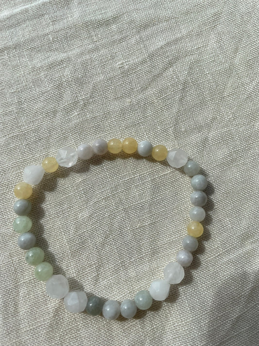 Yellow Forest natural gemstone bracelet arranged in a circle, showing Moss Agate, Green Aventurine and Dendritic Agate stones.