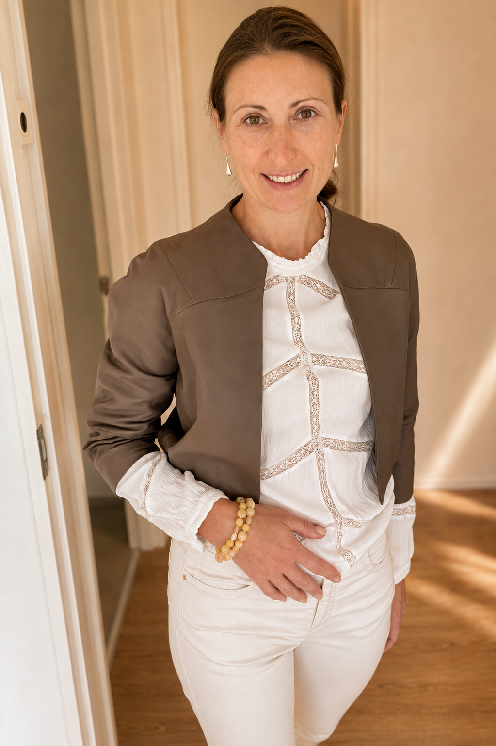Woman wearing the Golden Sunrise gemstone bracelet as an elegant everyday accessory.