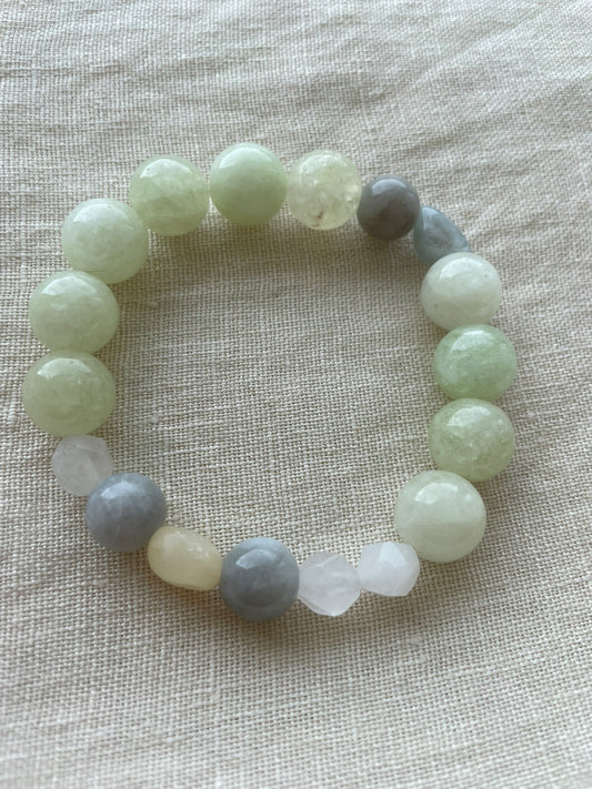 Serene Balance natural gemstone bracelet arranged in a circle, featuring green, blue, white and neutral natural gemstones.