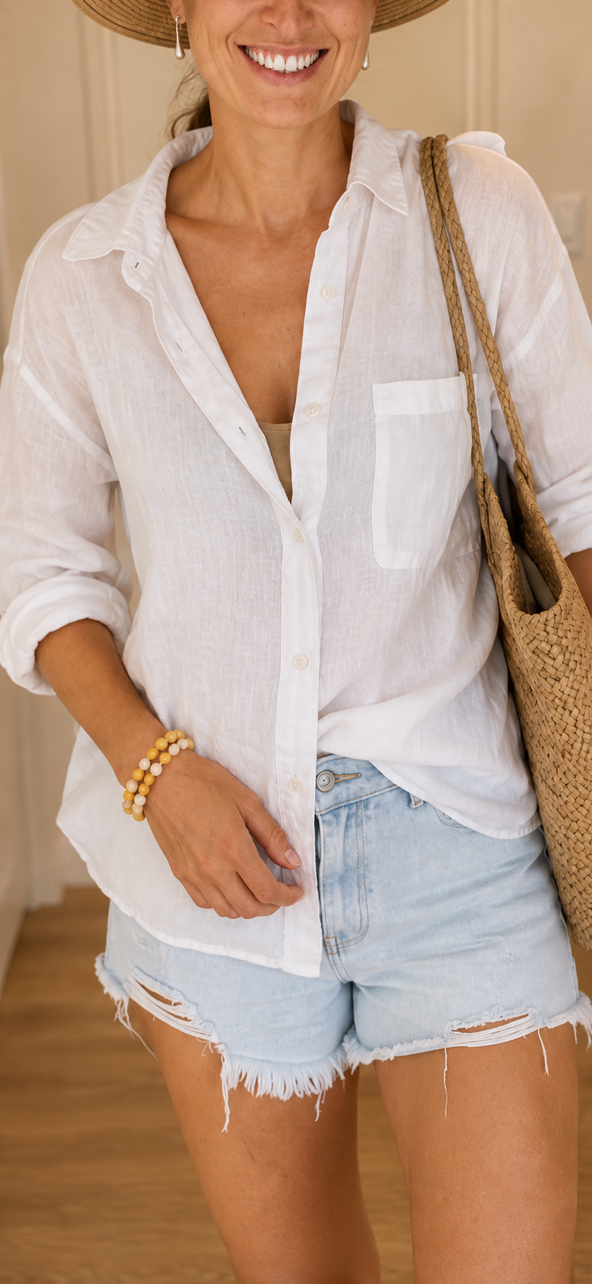 Woman wearing the handmade Golden Sunrise gemstone bracelet with warm golden and peach tones.