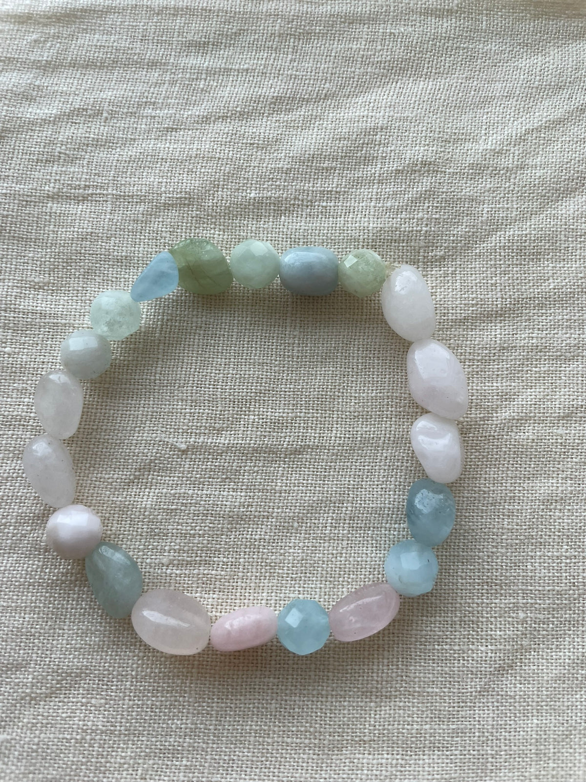 Pastel Serenity natural gemstone bracelet displayed in a circle with soft pink, white, blue and green gemstones.