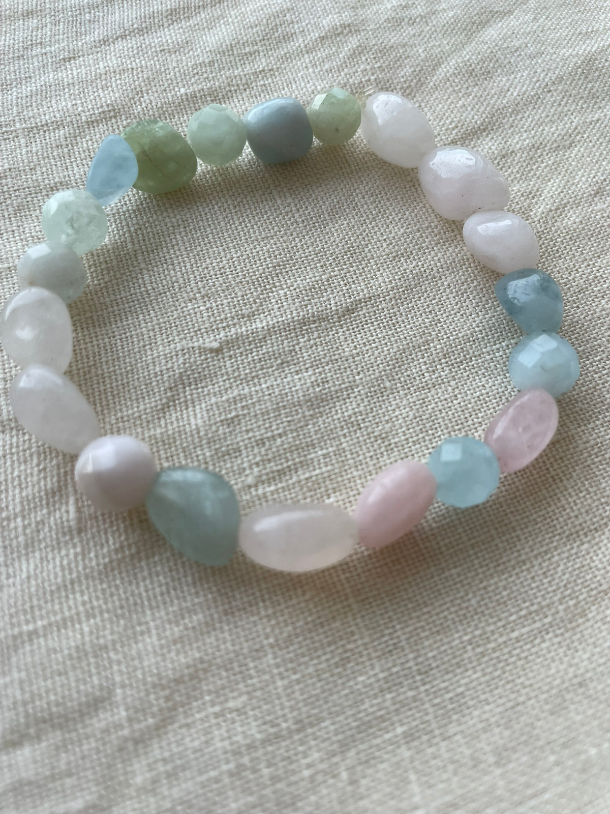Close-up of the Pastel Serenity gemstone bracelet featuring polished natural gemstones in soft pastel tones.