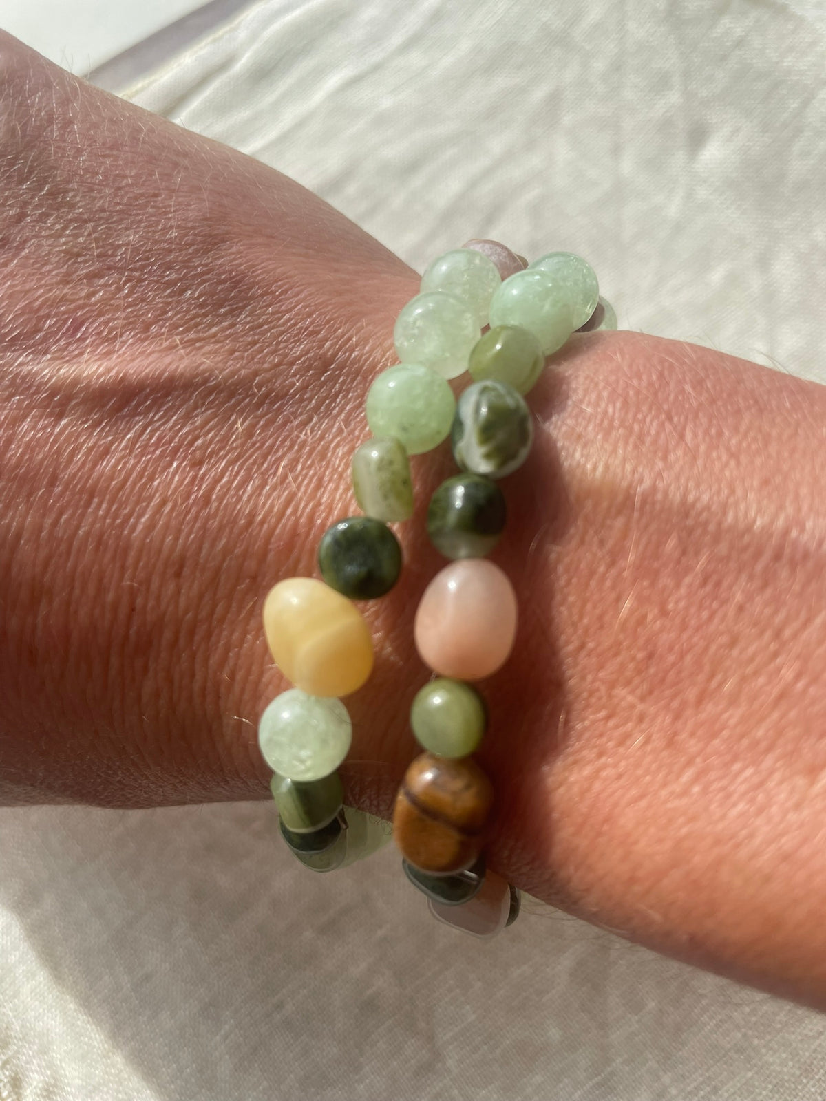 Close-up view of the Forest Garden bracelet showing natural gemstone colours, patterns and varied bead shapes.