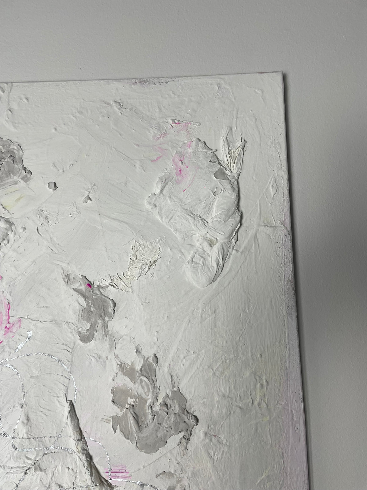 Close-up detail of Soft Whispers showing expressive textured marks in soft white, grey and pale pink.