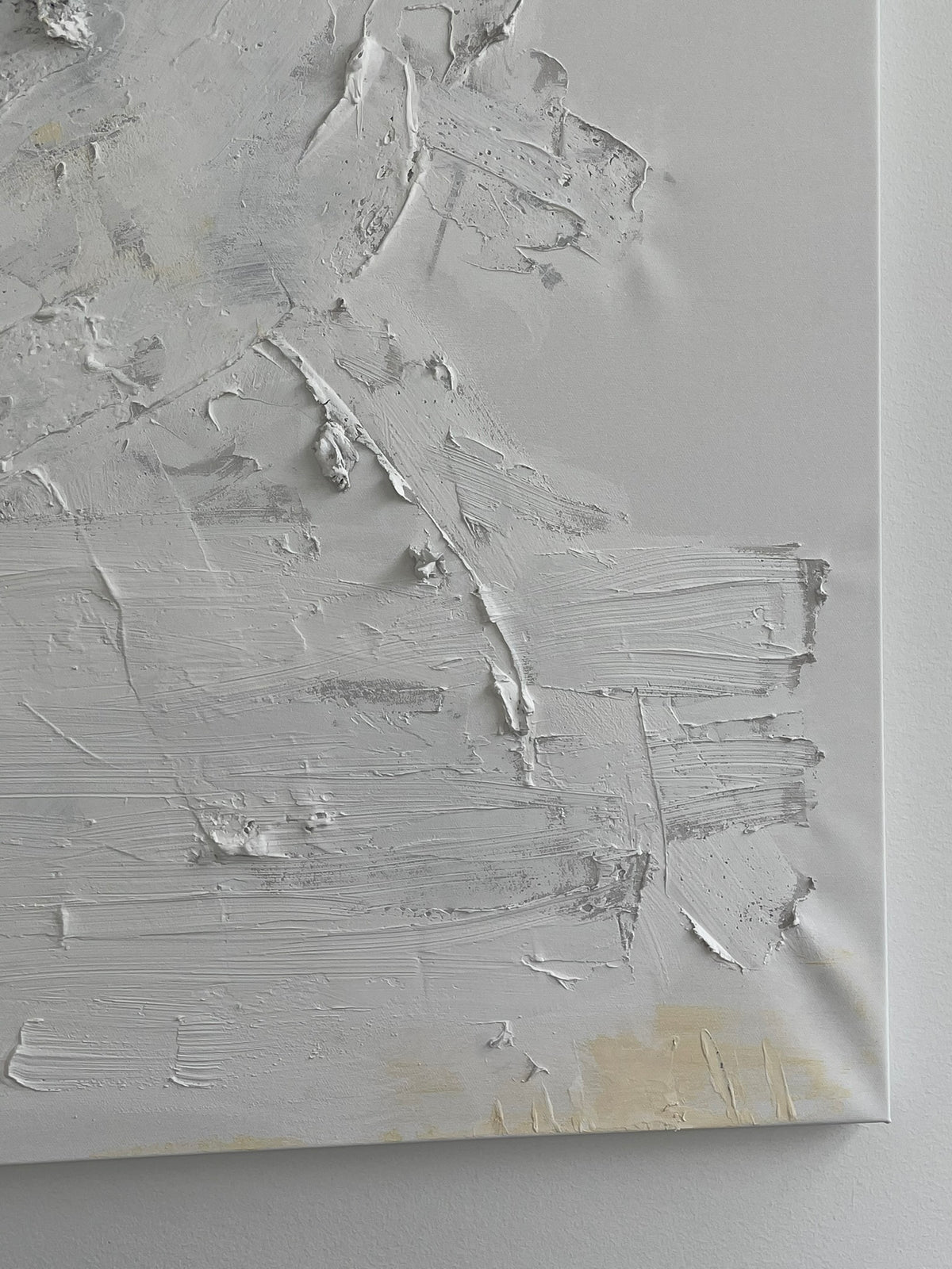 Close-up of Quiet Harmony original abstract painting with thick textured brushstrokes in soft ivory, light grey and subtle beige and golden tones.