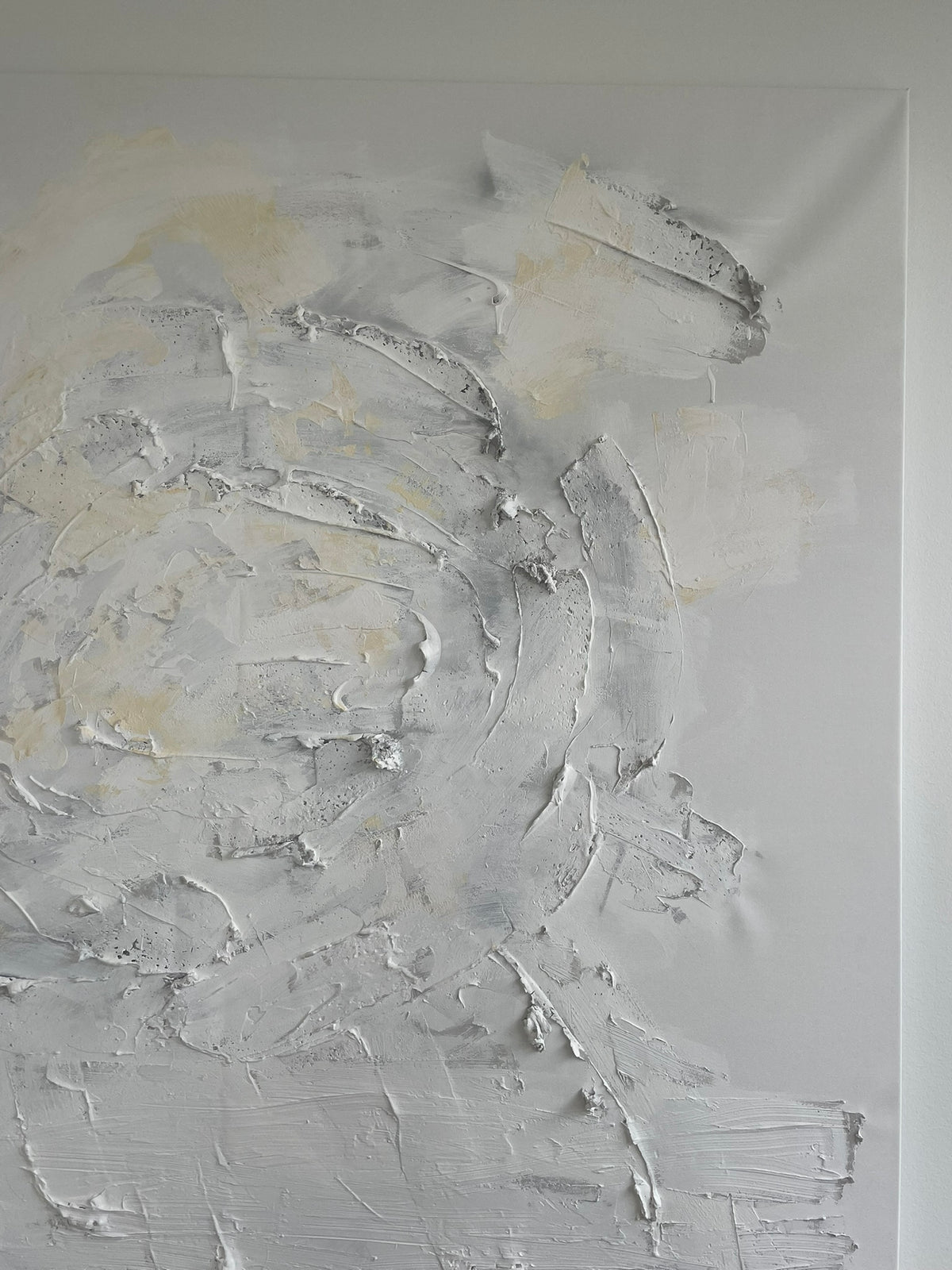 Close-up of Quiet Harmony original abstract painting with thick textured brushstrokes in soft ivory, light grey and subtle beige and golden tones.