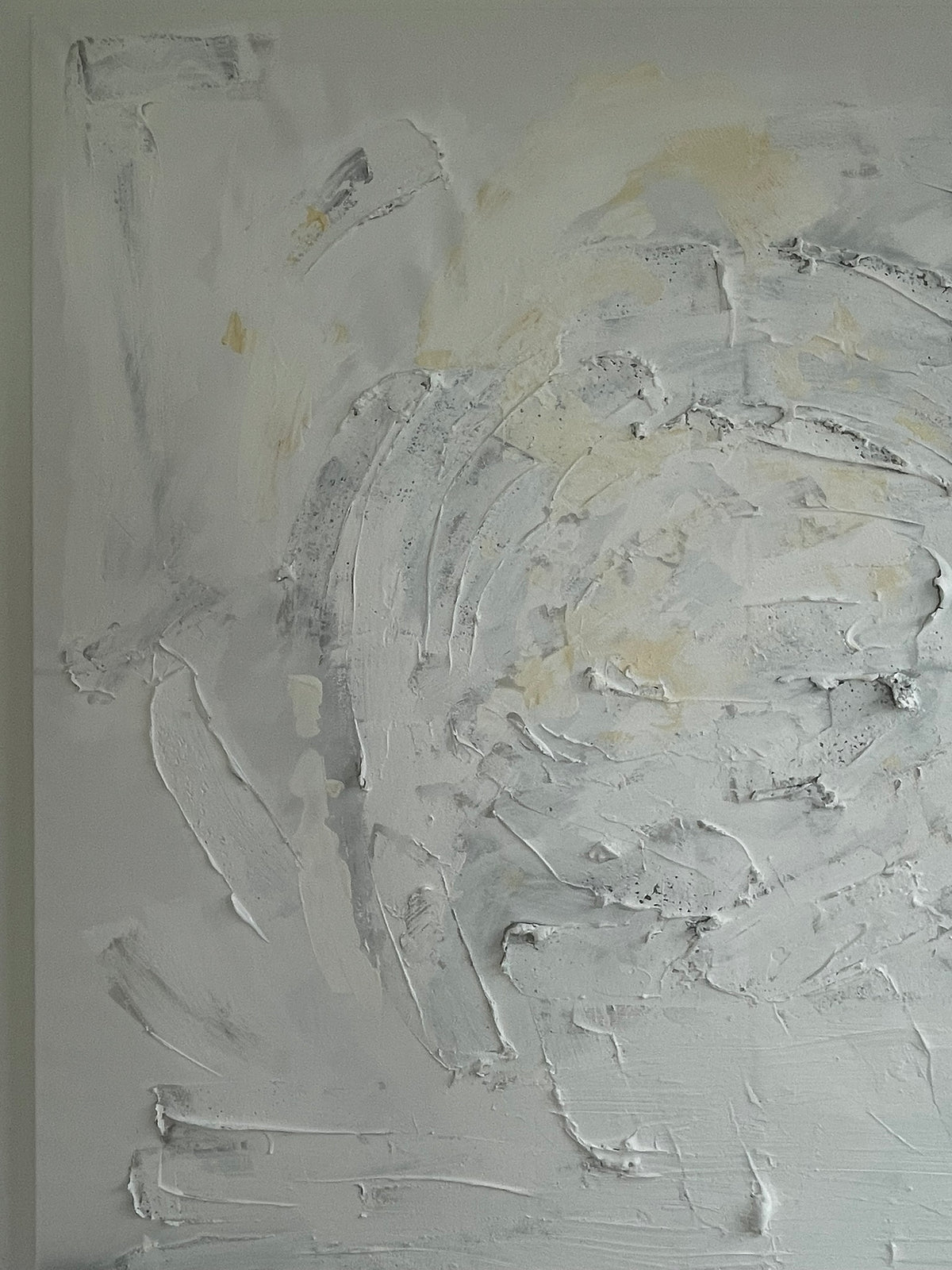 Detail of Quiet Harmony original abstract painting by Victoria Lorenz, showing thick textured brushstrokes in ivory, soft grey and pale golden tones