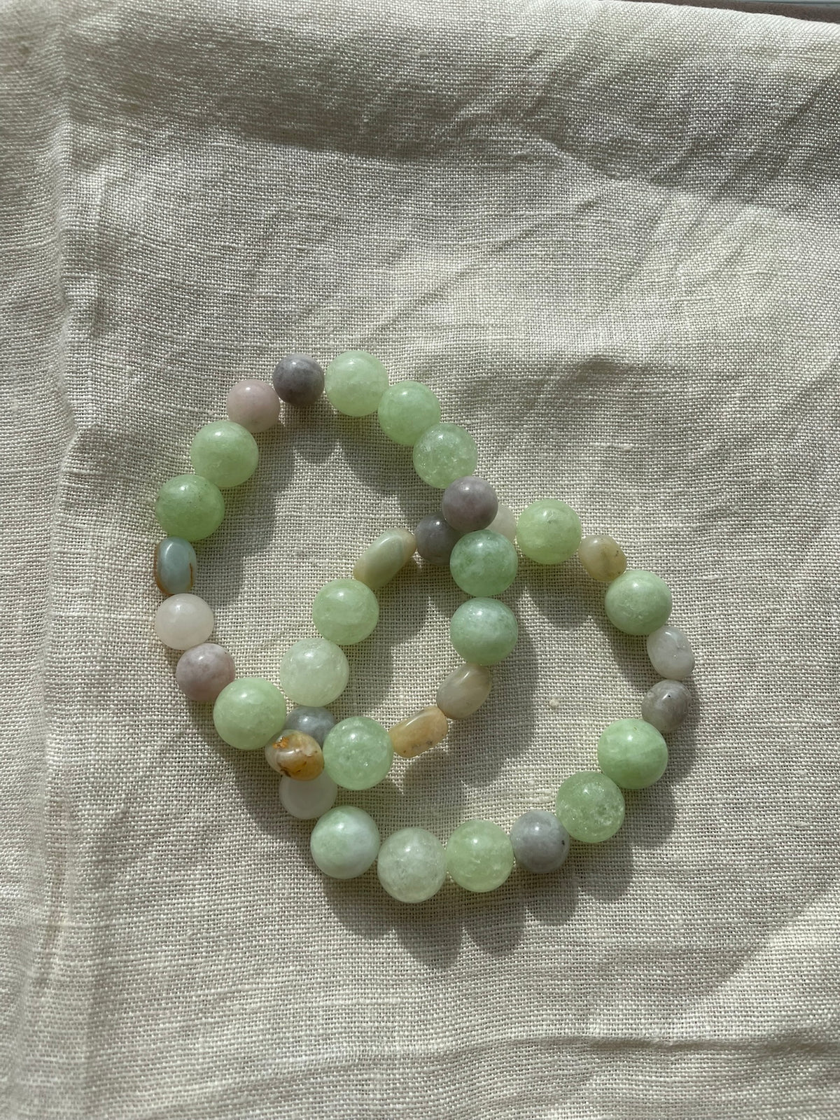 Soft Green Harmony natural gemstone bracelet displayed in a soft circular arrangement.