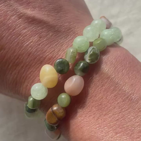 Video showing the Forest Garden natural gemstone bracelet worn on the wrist, highlighting its soft green, white and earthy tones.