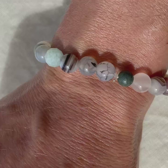 Video showing the Forest Coast natural gemstone bracelet worn on the wrist, highlighting its natural colours and gemstone details.