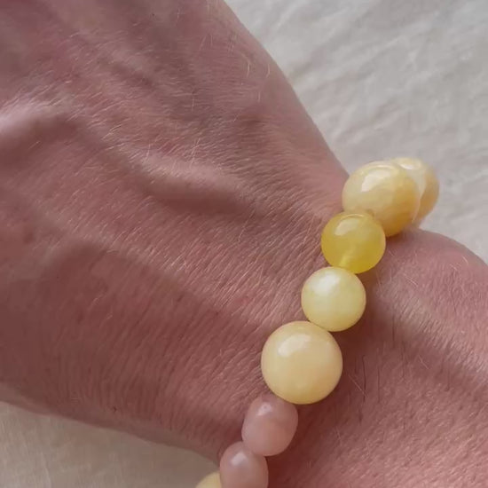 Video showing the handmade Golden Sunrise natural gemstone bracelet and its warm golden, honey and peach tones.