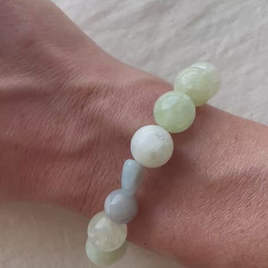 Video showing the Serene Balance handmade natural gemstone bracelet with soft green, misty blue, creamy white and natural tones.
