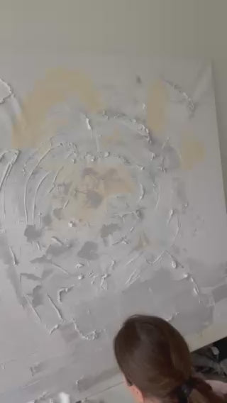 Victoria Lorenz creating Quiet Harmony, an original abstract painting in Denmark, applying layered textures and soft ivory, grey, beige and golden tones to canvas.